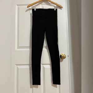Size 6 Lululemon leggings in black with lace sides.